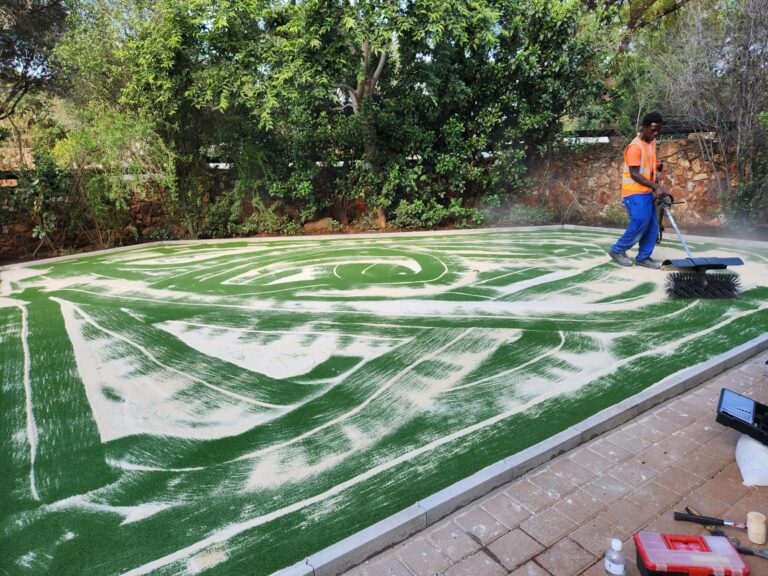 Infill material top up for artificial grass